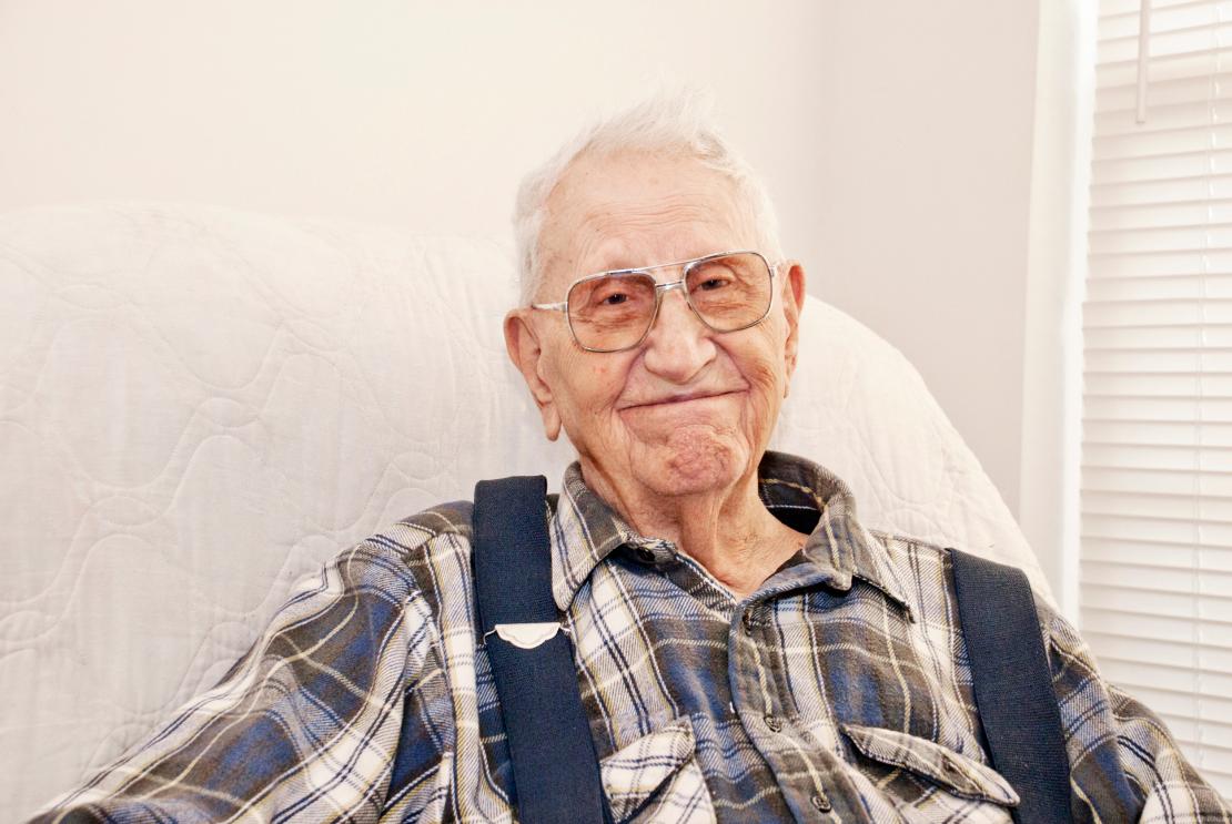 Older-man-in-bed-in-care-home